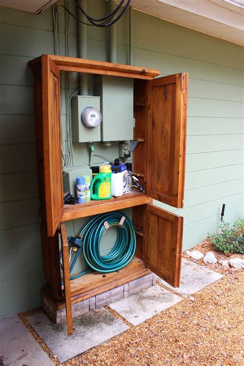 hide electrical box on patio|best way to hide water boxes.